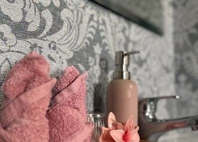 Elegant towels and soap on a decorative counter at Aroma Massage, Auckland, Auckland, NZ, evoke a relaxing atmosphere.