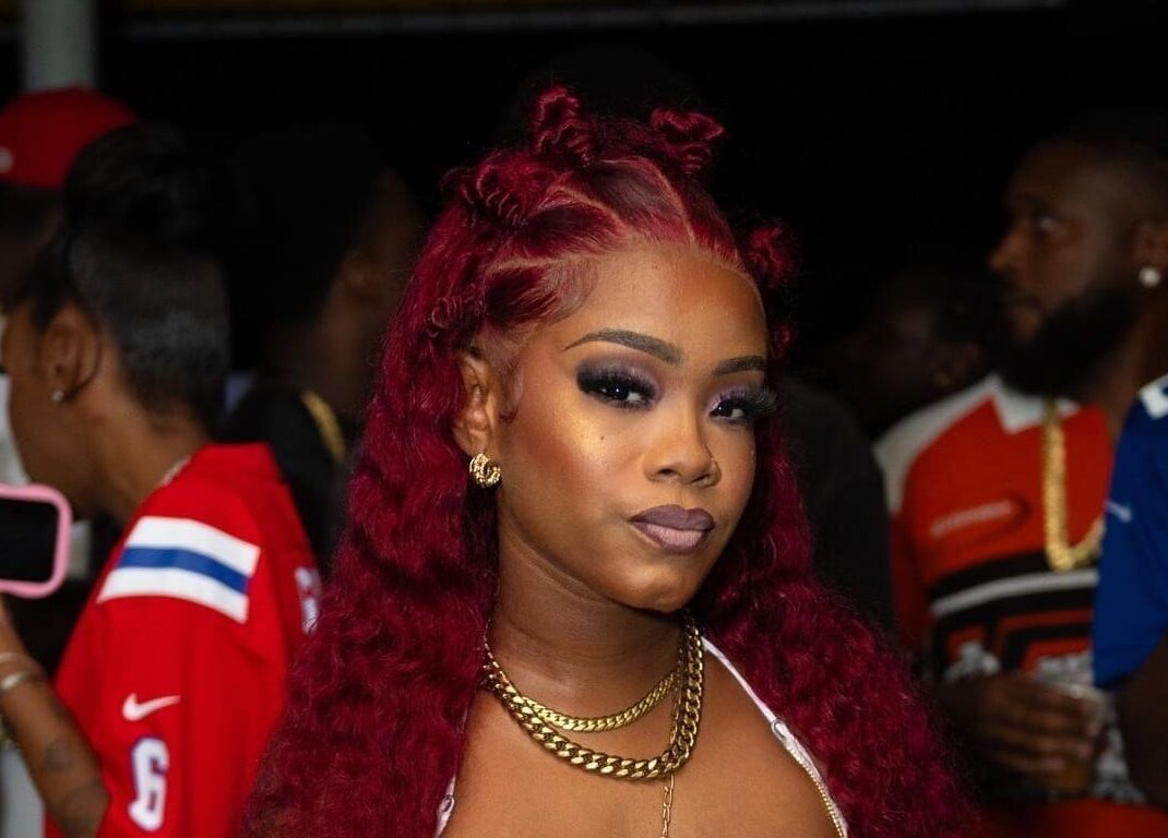 Chic lady with bold hairstyle at Dee Luxe Wigs, Saint George, BB.