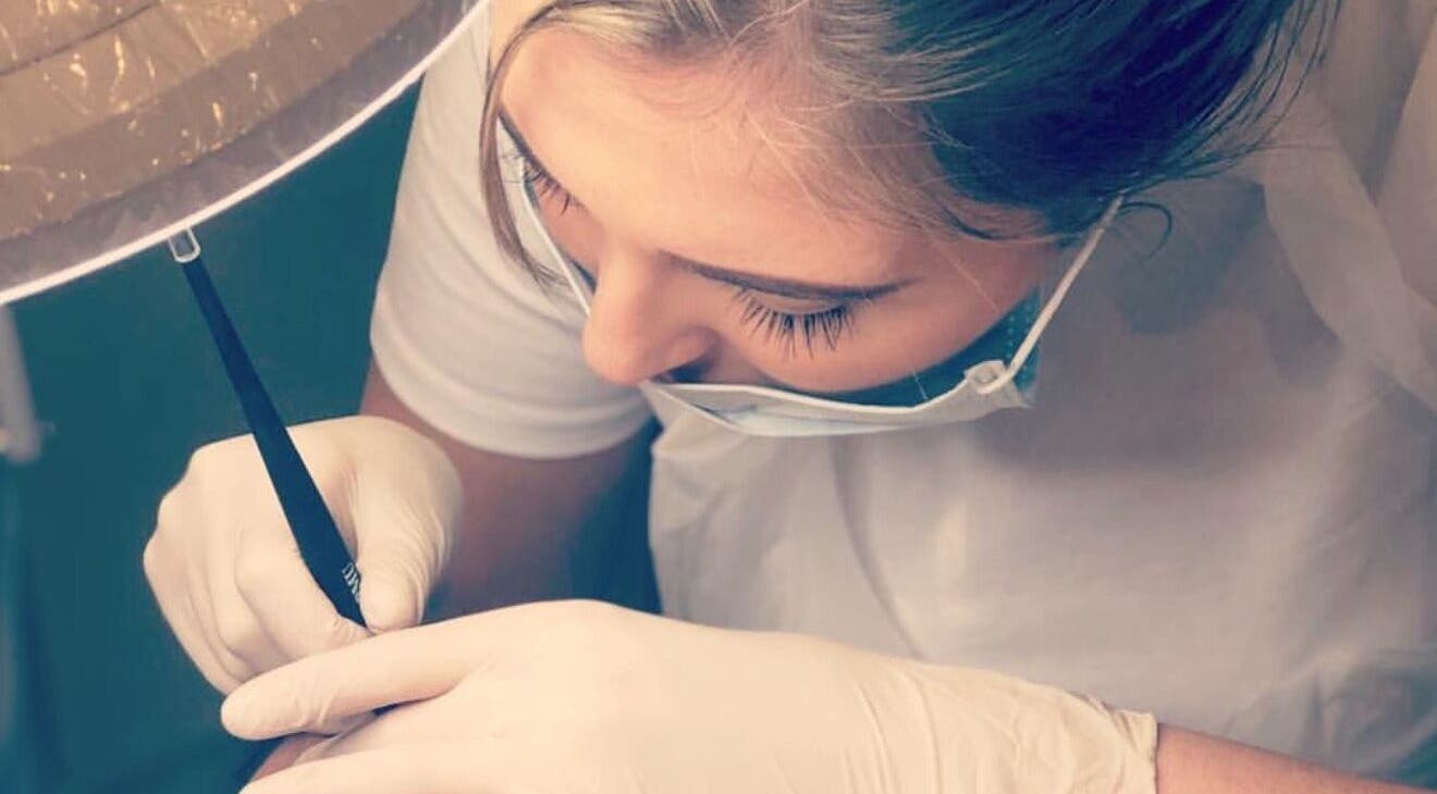 Artist at Blinx Brows by Ashton performing microblading in Rugby, England, GB. Precision in beauty techniques.