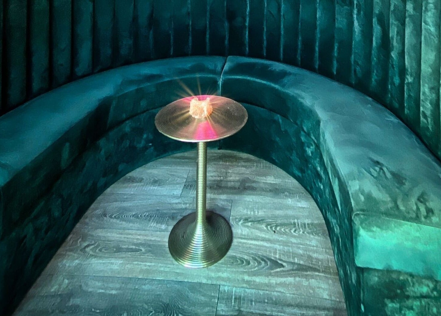 Elegant seating area at ELZYT, Drogheda, County Louth, IE, with plush green upholstery and warm lighting.