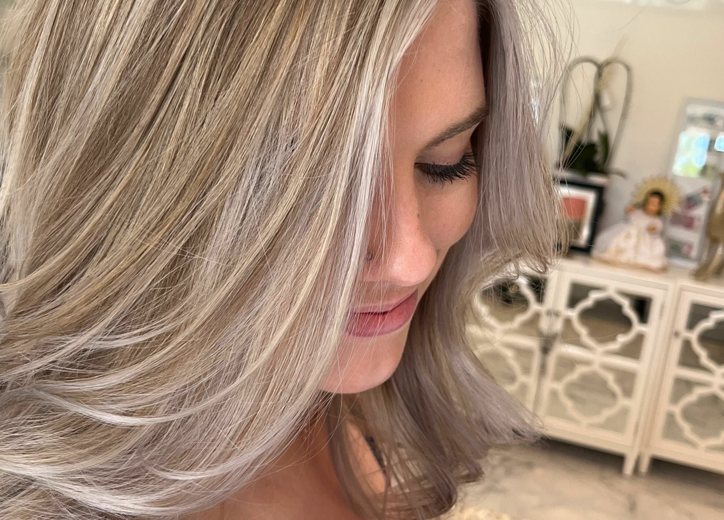 Elegant blonde hairstyle at Cevaluk, Waynesboro, Virginia, US salon showcasing expert coloring.