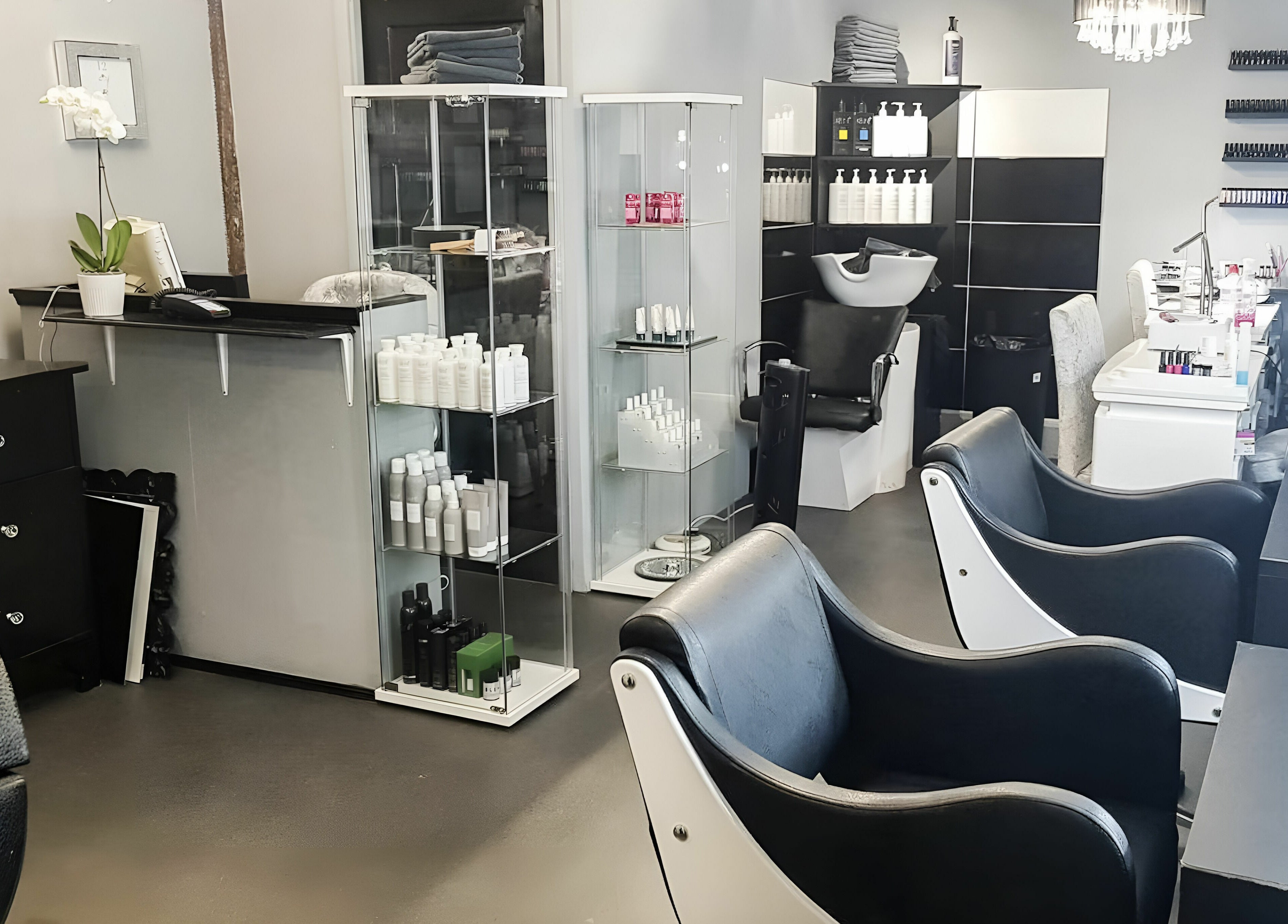 Modern salon chairs and shelves at KM Hair and Beauty in Braintree, England, GB offering premium services.