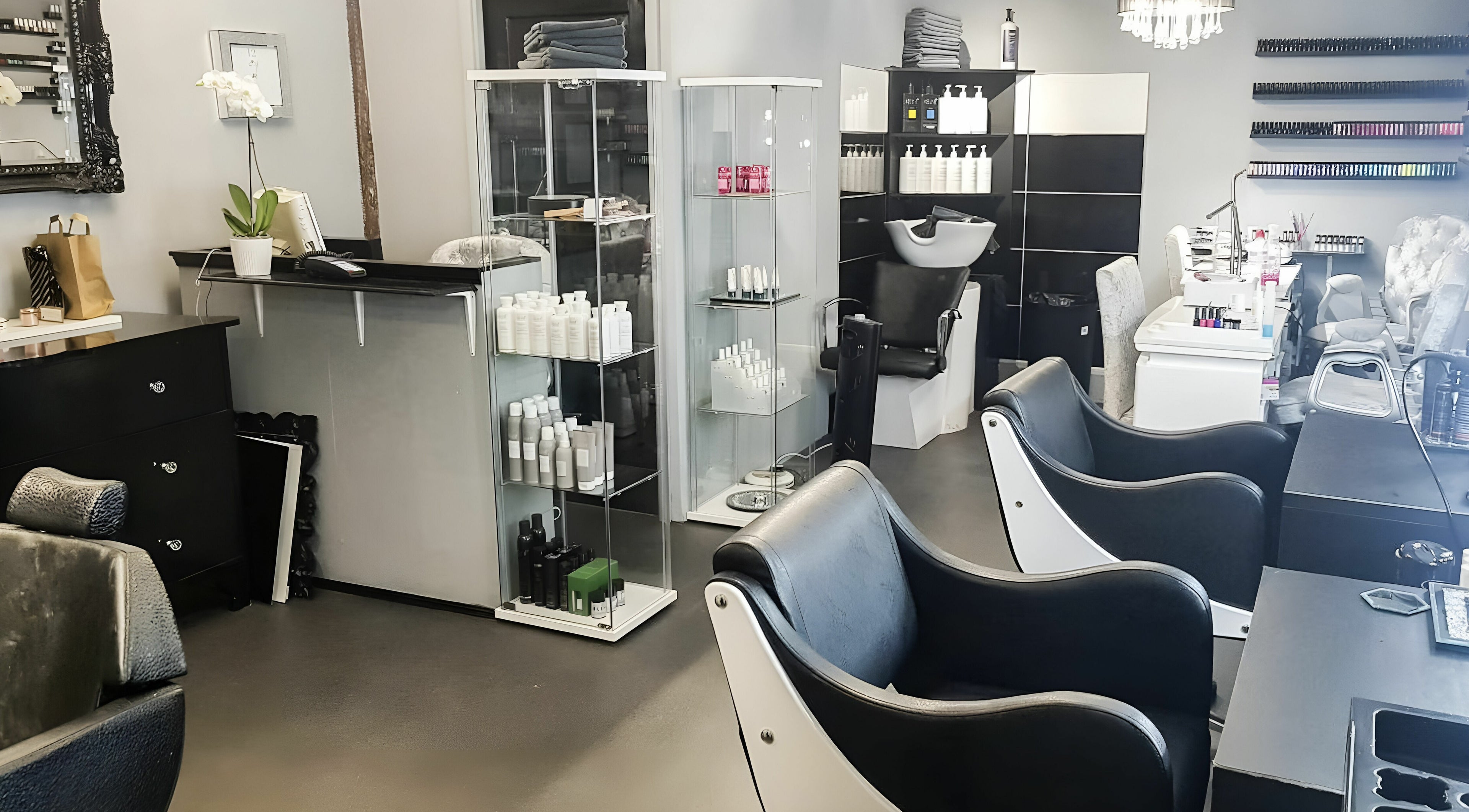 Modern salon chairs and shelves at KM Hair and Beauty in Braintree, England, GB offering premium services.