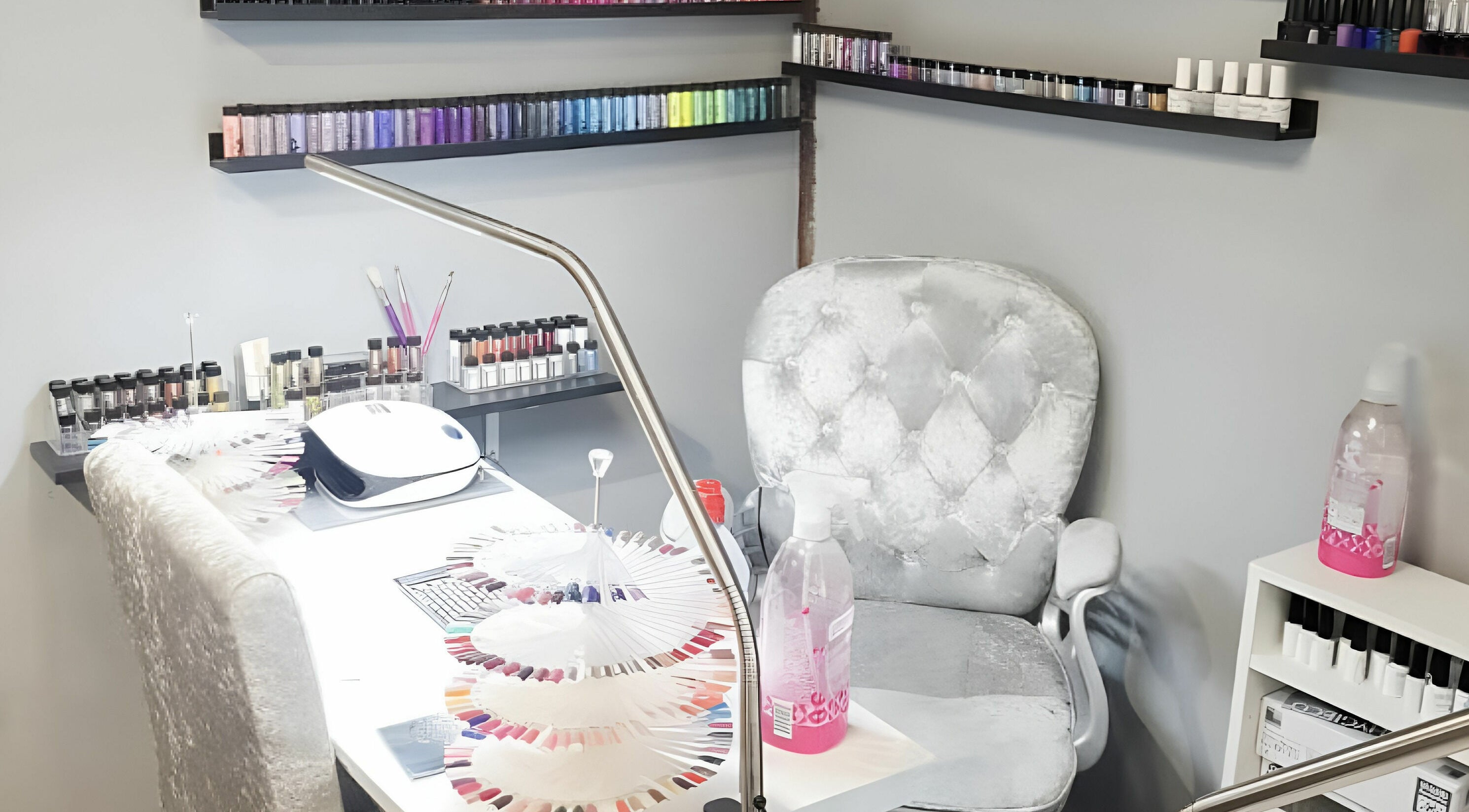 Elegant nail art station at KM Hair and Beauty, Braintree, England, GB, with vibrant polish display.