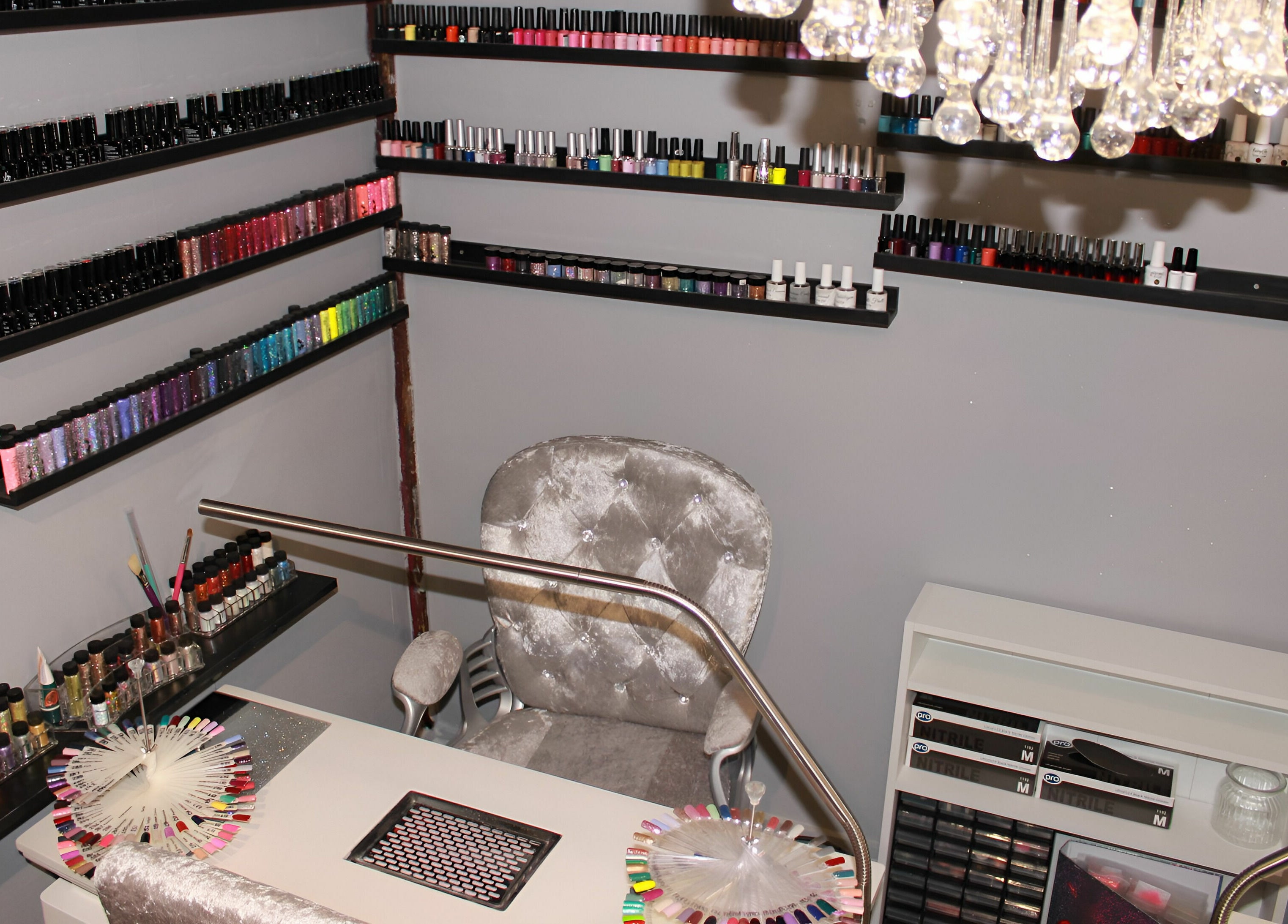Luxurious nail care station at KM Hair and Beauty, Braintree, England, GB, showcasing elegant decor and polish selection.