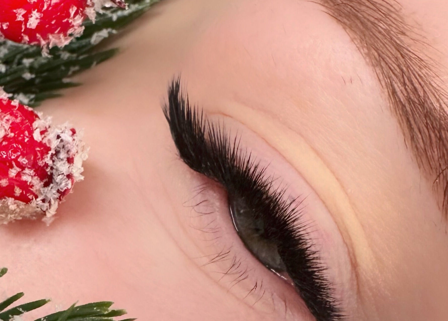 Close-up of styled eyelashes at M.E Glam Room in Sutton-in-Ashfield, England, GB with festive decor.