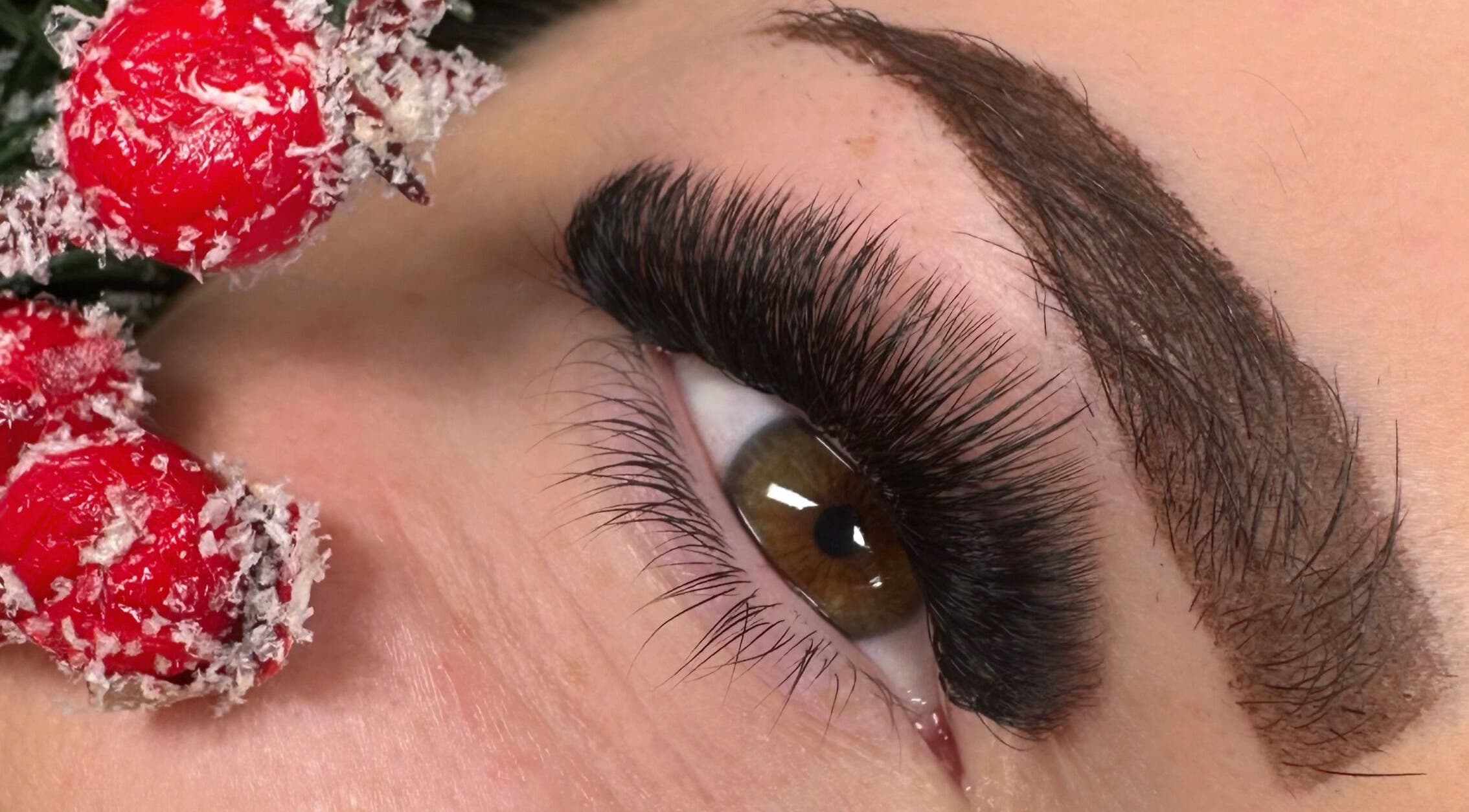 Close-up of eye with thick lashes at M.E Glam Room, Sutton-in-Ashfield, England, GB.