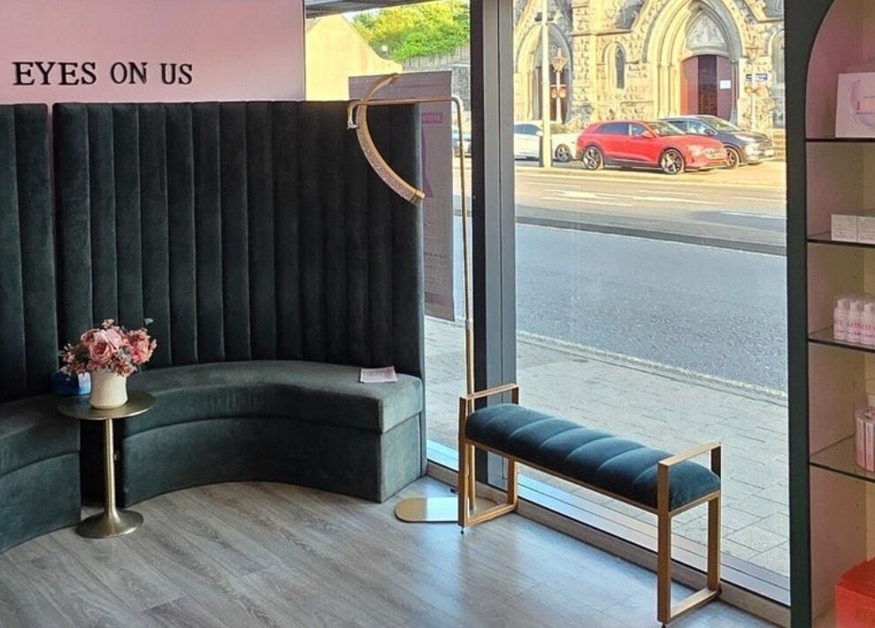 Elzyt Salon Kristina in Drogheda, IE features a stylish lounge with velvet seating and a street view.