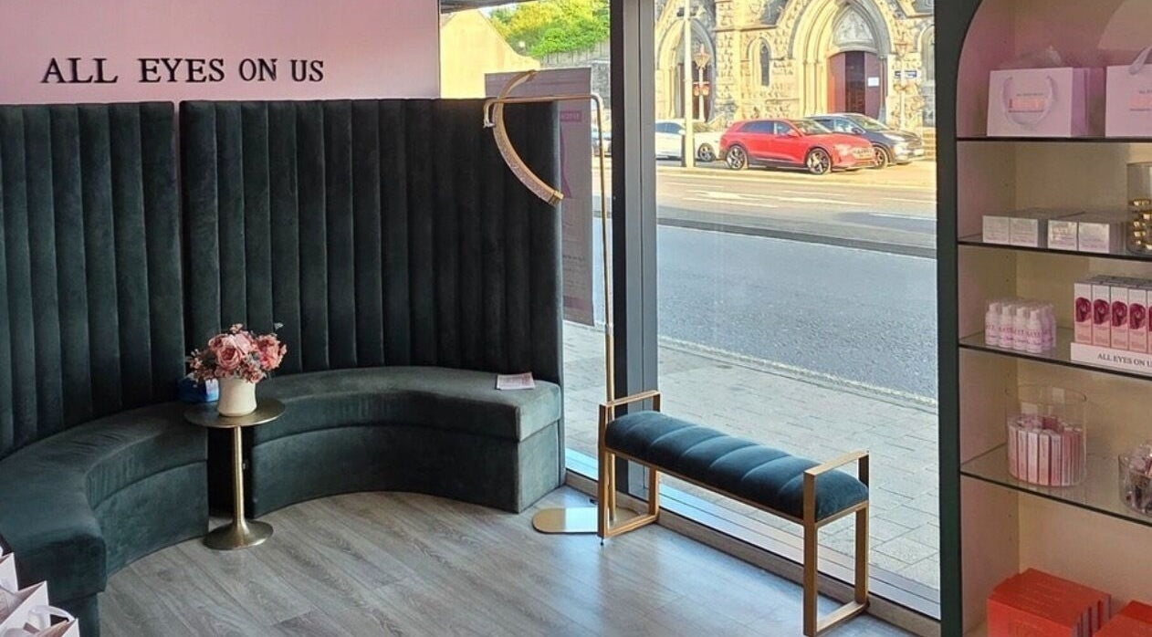 Elzyt Salon Kristina in Drogheda, IE features a stylish lounge with velvet seating and a street view.