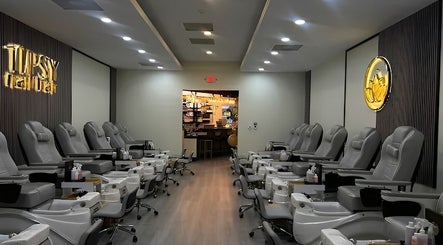 Luxurious nail salon chairs at Tipsy Nail Bar, College Parkway, Fort Myers, Florida, US.