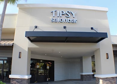 Front view of Tipsy Nail Bar, College Parkway in Fort Myers, Florida, US, highlighting the modern entrance.