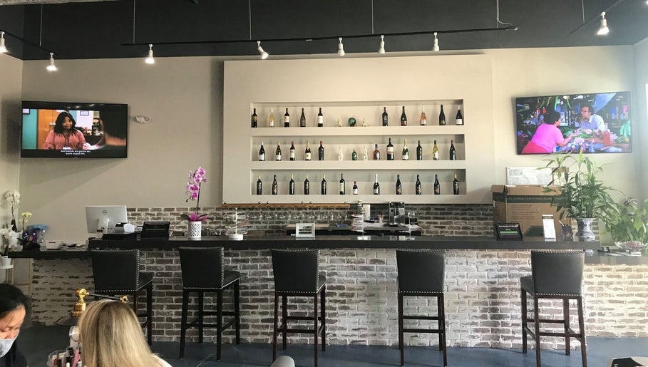 Stylish bar area at Tipsy Nail Bar, Daniels Parkway in Fort Myers, Florida, US with elegant seating and decor.