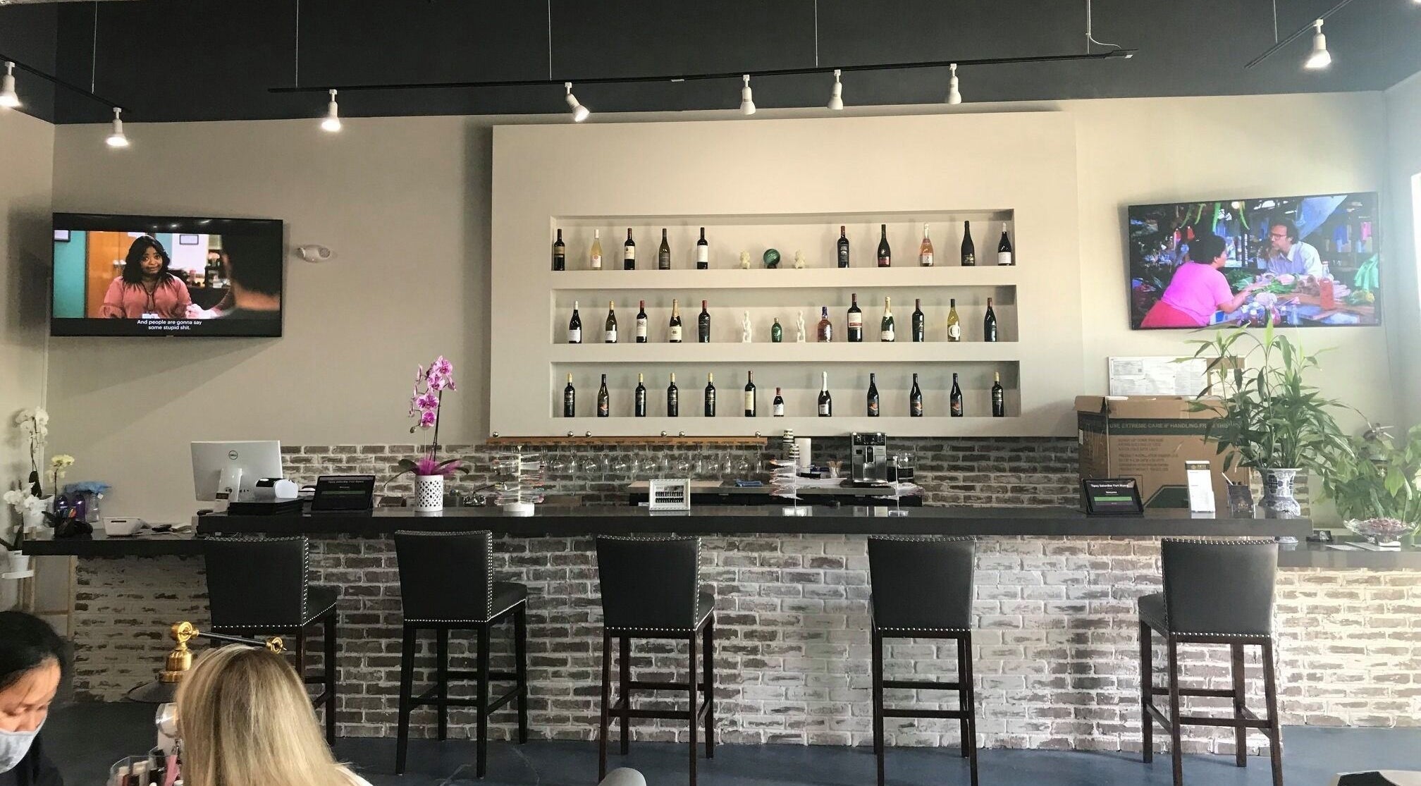 Stylish bar area at Tipsy Nail Bar, Daniels Parkway in Fort Myers, Florida, US with elegant seating and decor.