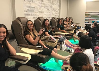 Women enjoy pedicures at Tipsy Nail Bar, Daniels Parkway, Fort Myers, Florida, US.