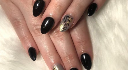 Elegant black and gold nail art at Tipsy Nail Bar, Daniels Parkway, Fort Myers, Florida, US.