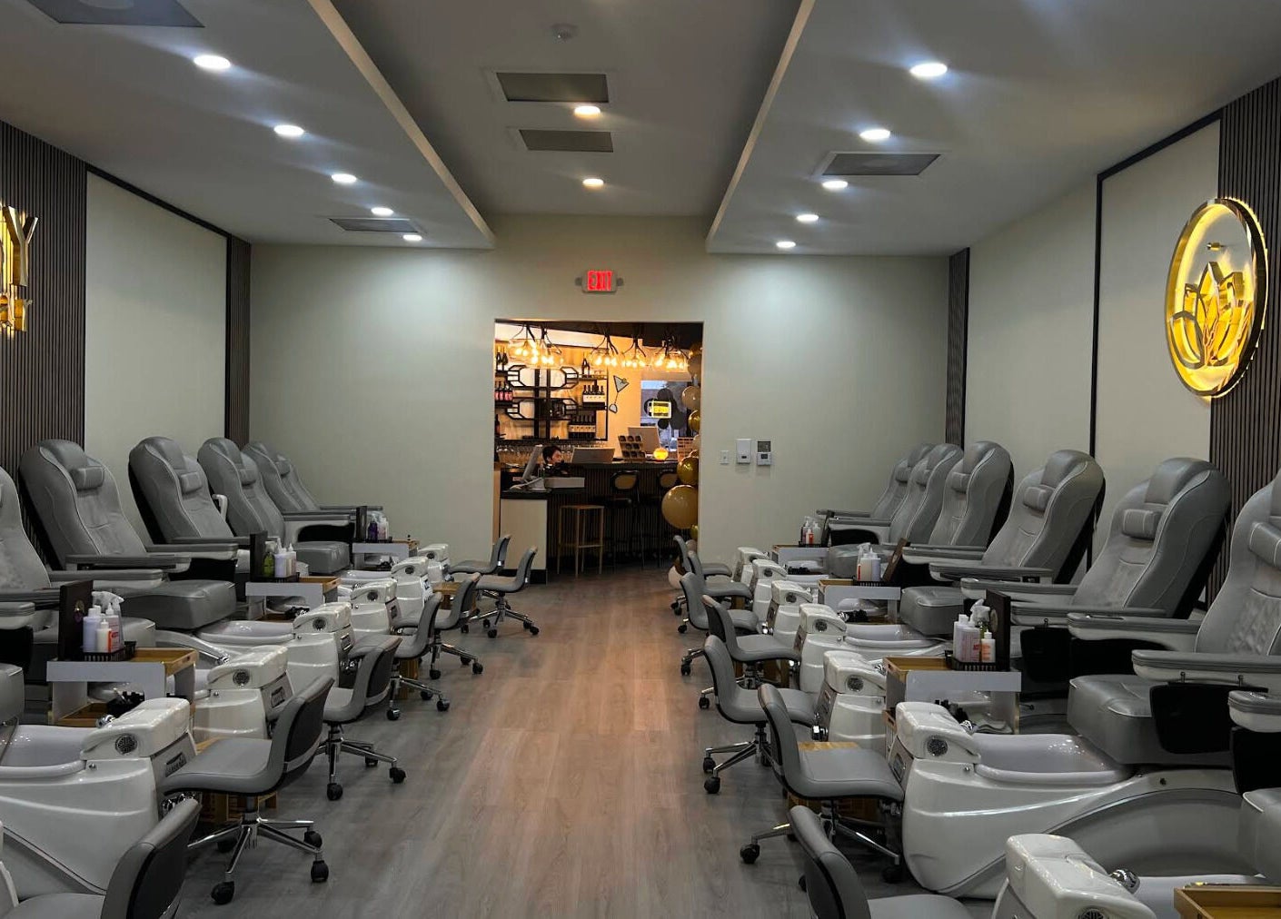 Interior of Tipsy Nail Bar, College Parkway in Fort Myers, Florida, US showcasing plush pedicure chairs.