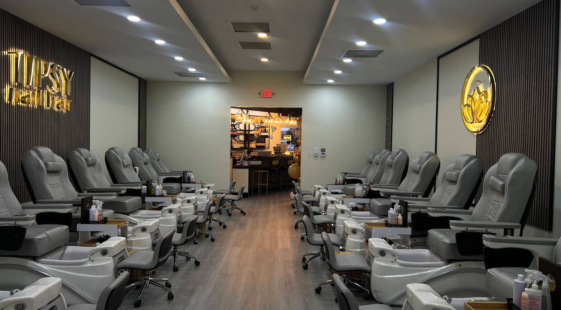 Interior of Tipsy Nail Bar, College Parkway in Fort Myers, Florida, US showcasing plush pedicure chairs.