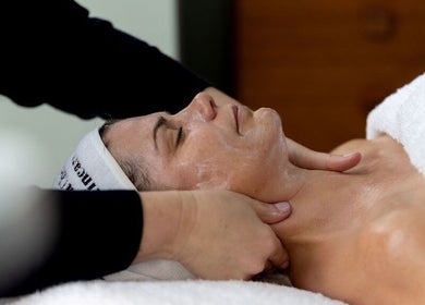 Client enjoying a luxurious facial massage at Victoria Cheek Facialist in Leigh-on-Sea, England, GB.