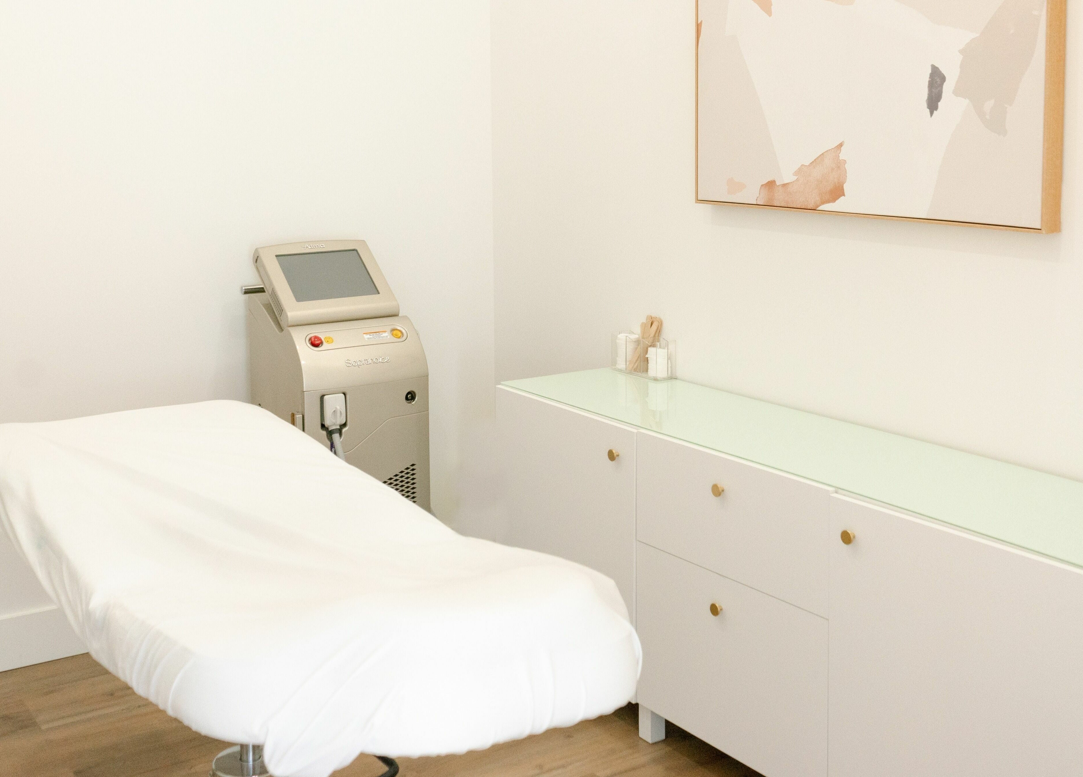 Elegant laser treatment room at Laser Bar, Barrie, Ontario, CA, featuring a sleek, modern design.