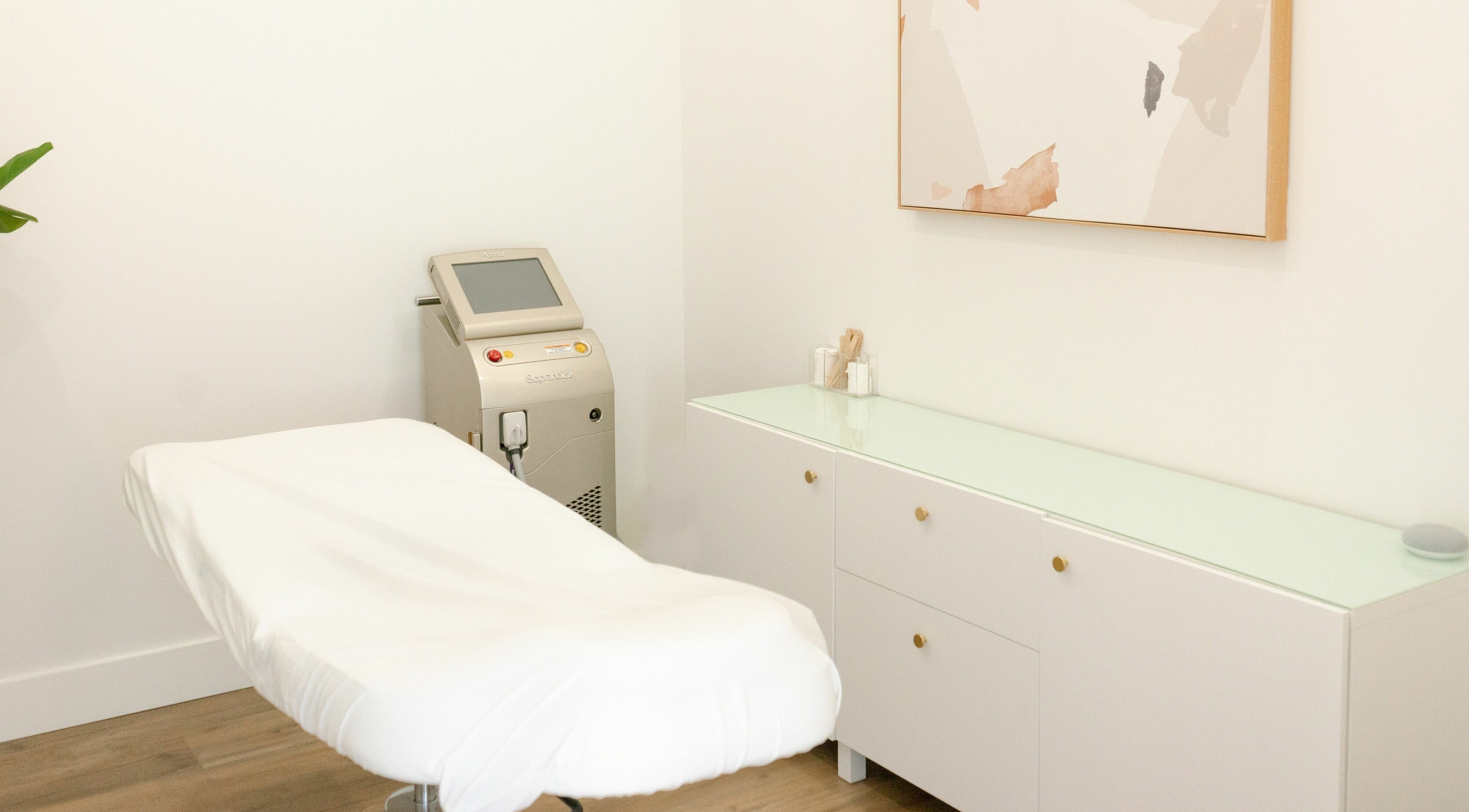 Elegant laser treatment room at Laser Bar, Barrie, Ontario, CA, featuring a sleek, modern design.