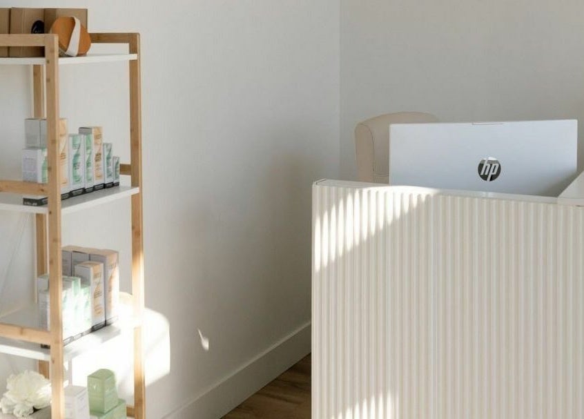 Sleek reception area at Laser Bar, Barrie, Ontario, CA, showcasing modern design and calming aesthetics.