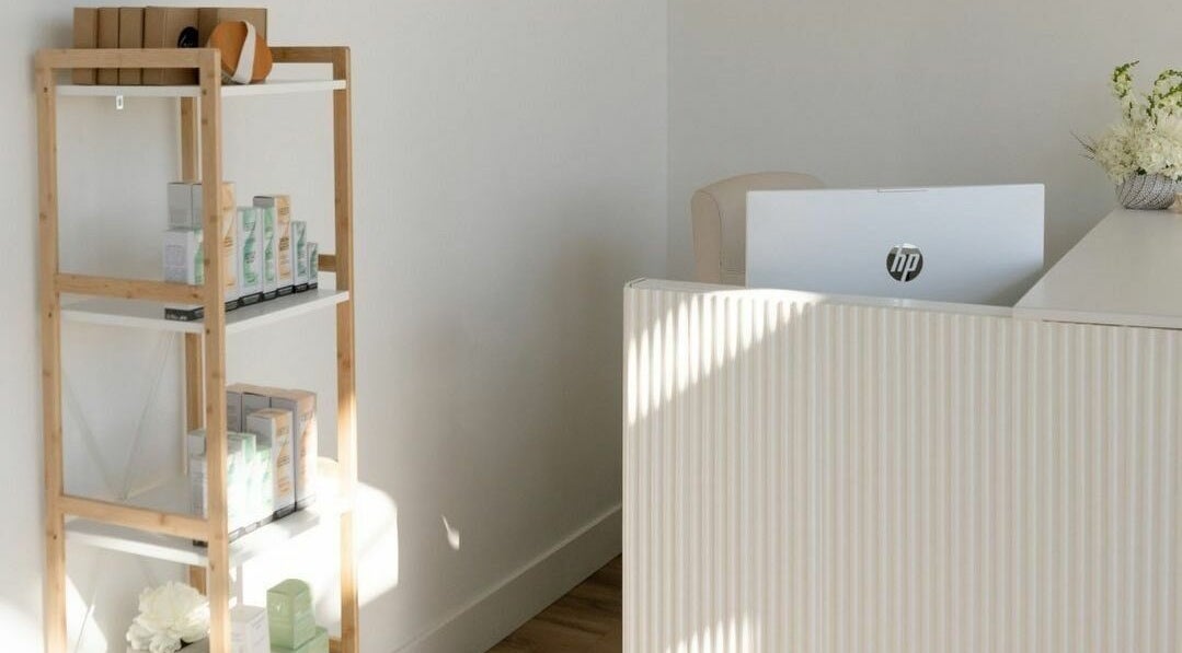 Sleek reception area at Laser Bar, Barrie, Ontario, CA, showcasing modern design and calming aesthetics.