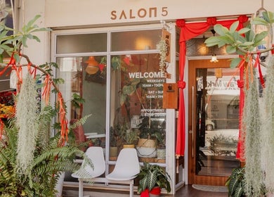 Elegant entrance of Salon5 adorned with greenery in Singapore, Singapore, SG.