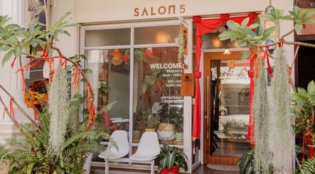 Elegant entrance of Salon5 adorned with greenery in Singapore, Singapore, SG.
