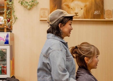 Client enjoying hairstyling at Salon5, Singapore, SG, embodying welcoming ambiance and expert service.