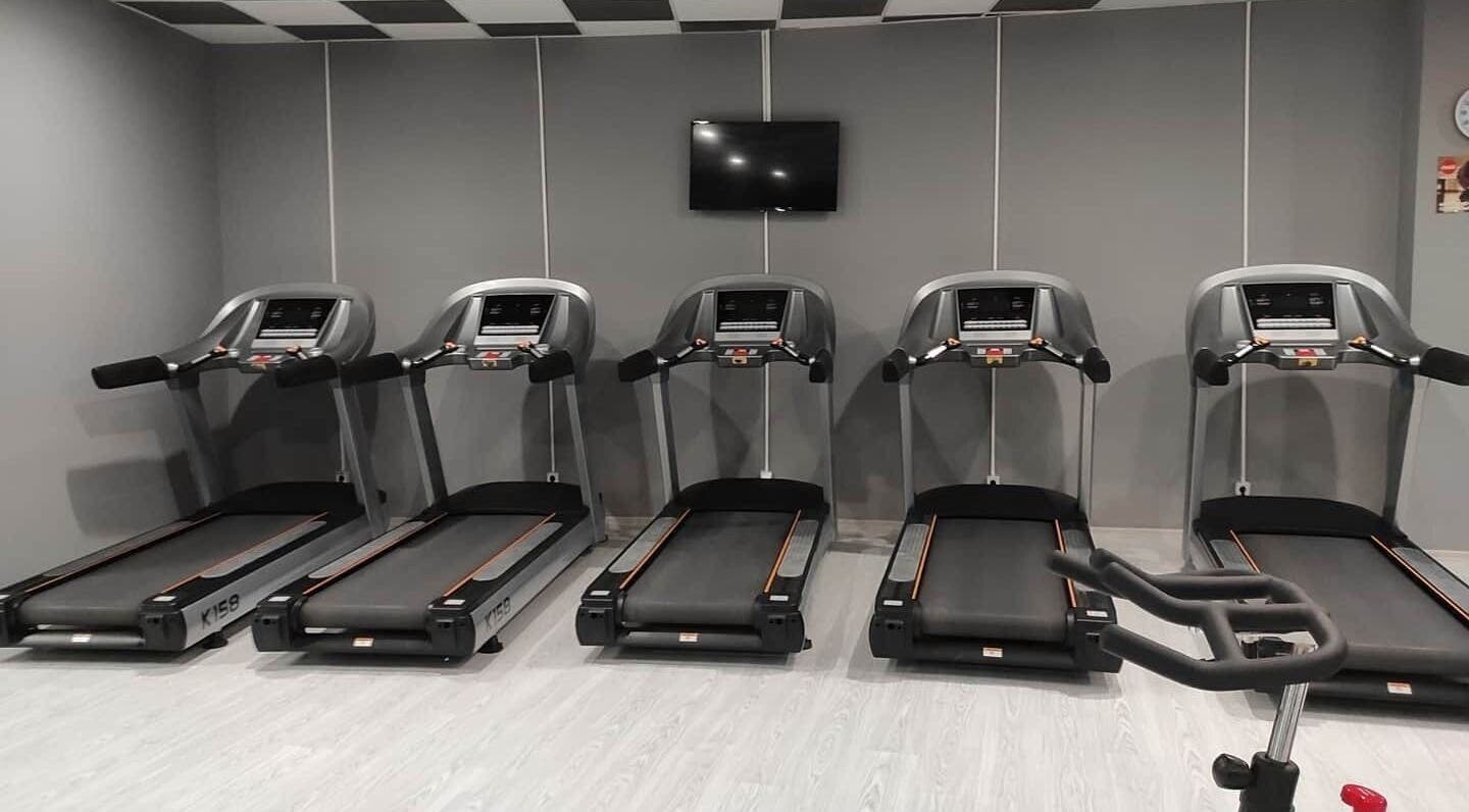 Modern gym treadmills at Bendis Spa in Edirne, Edirne, TR, offering a serene workout environment.