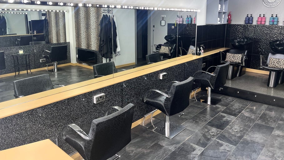 Sleek salon interior at Joanne at Jo Dazzle, Aberdeen, Scotland, GB, featuring stylish seating and mirrors.