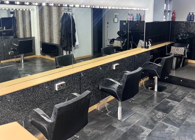 Sleek salon interior at Joanne at Jo Dazzle, Aberdeen, Scotland, GB, featuring stylish seating and mirrors.
