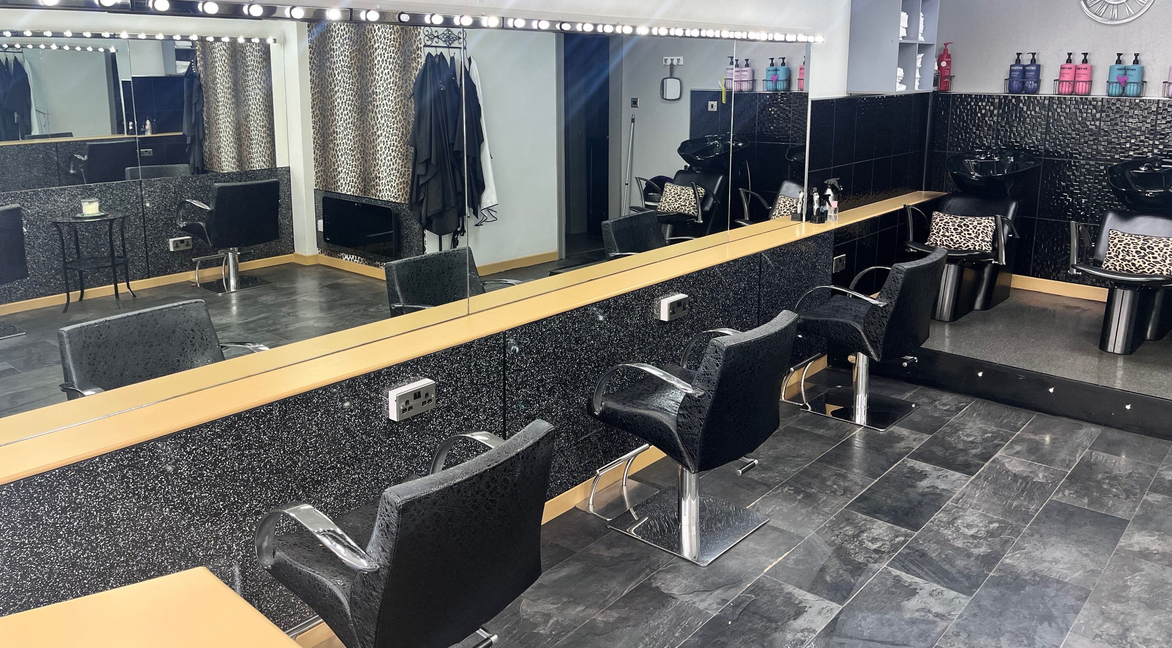 Sleek salon interior at Joanne at Jo Dazzle, Aberdeen, Scotland, GB, featuring stylish seating and mirrors.