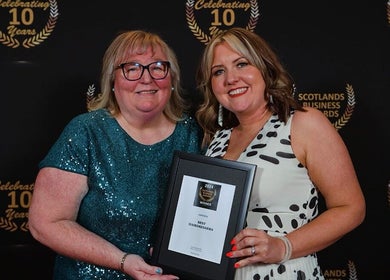 Joanne at Jo Dazzle wins award in Aberdeen, Scotland, GB at business event.