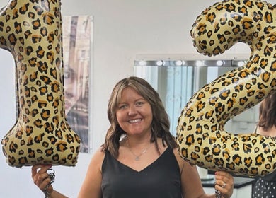 Joanne celebrates with leopard print balloons at Jo Dazzle in Aberdeen, Scotland, GB.