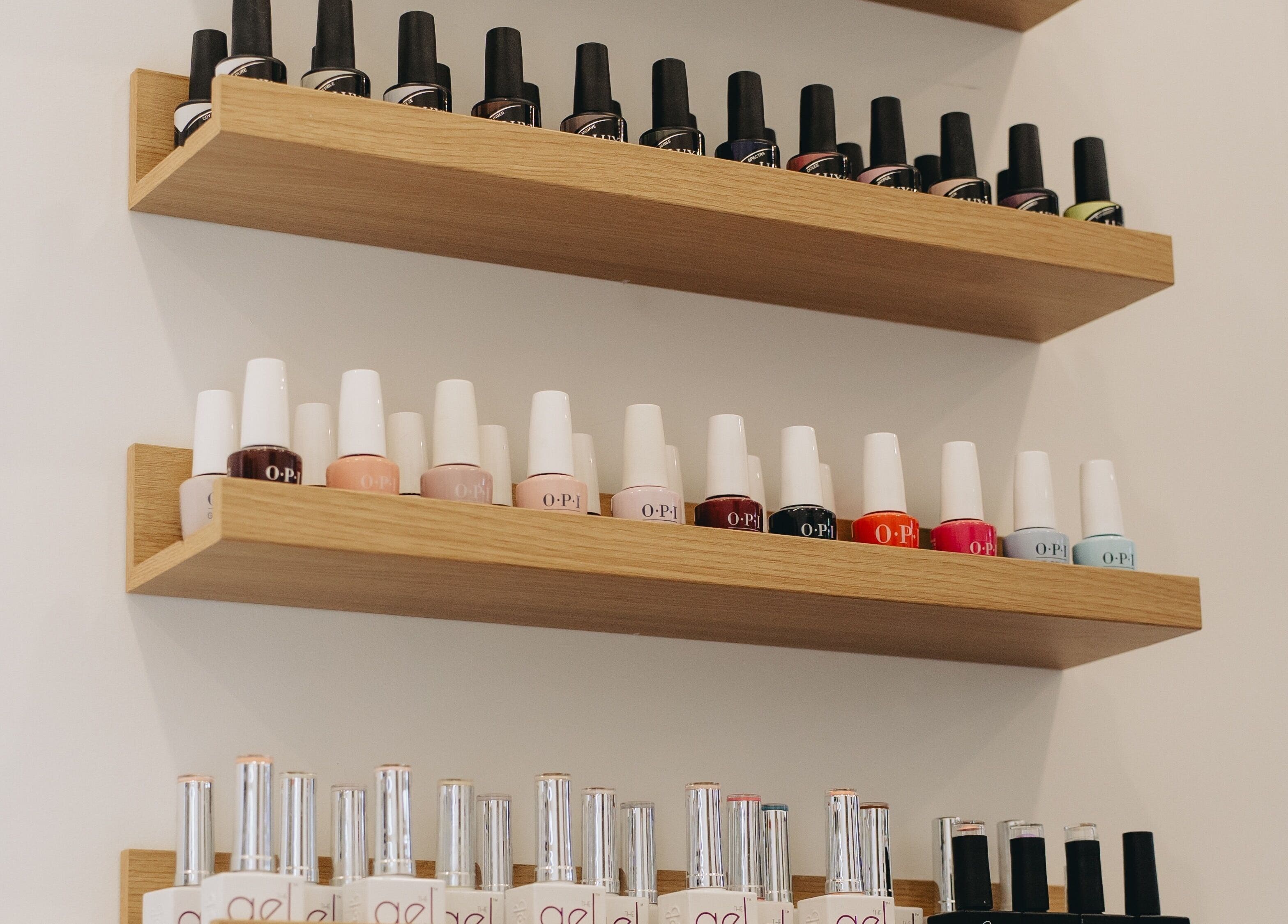 Nail polish display at Tiny Luxury Spa, Winkler, Manitoba, CA showcases vibrant color options for a fresh manicure.
