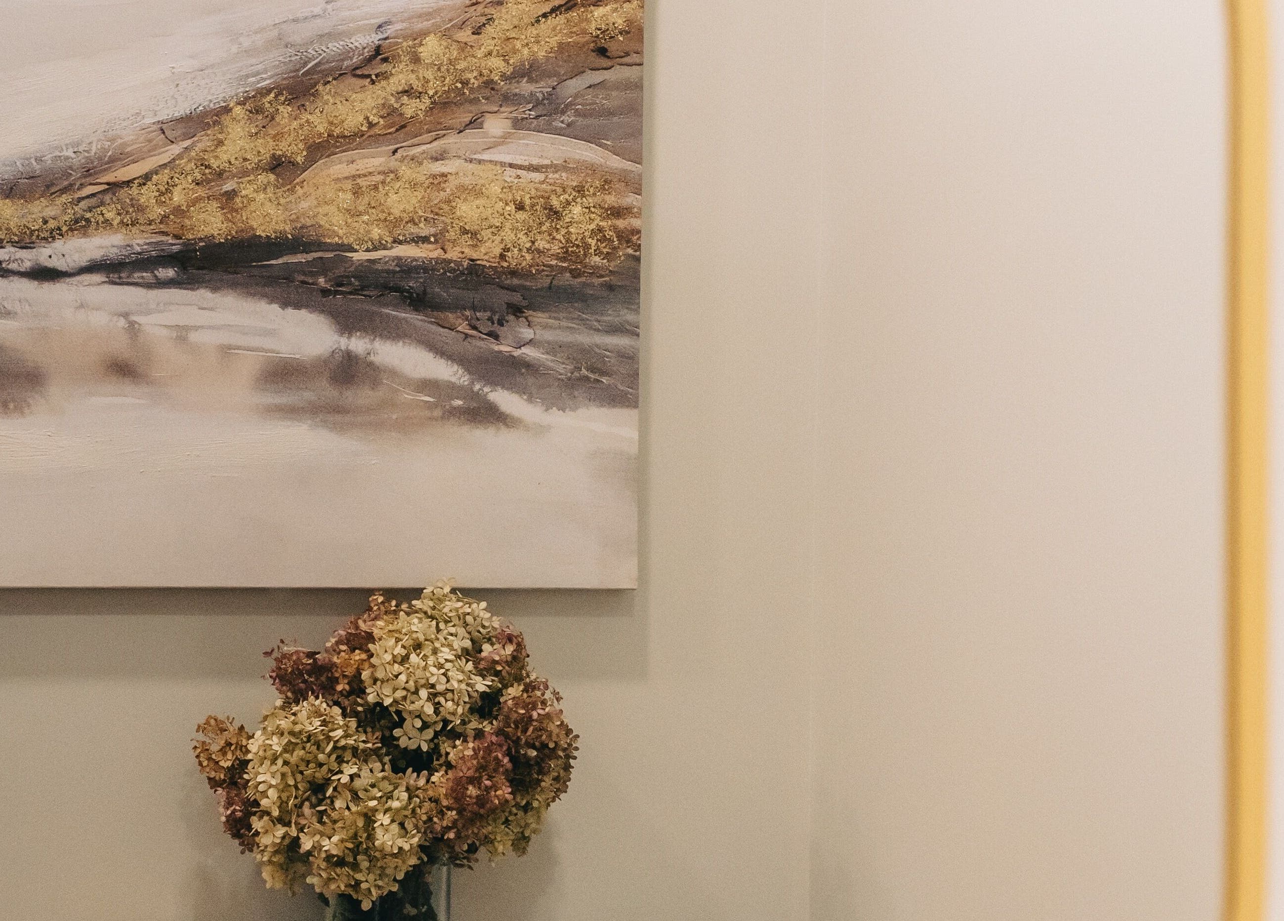 Elegant wall art and dried flowers at Tiny Luxury Spa in Winkler, Manitoba, CA.