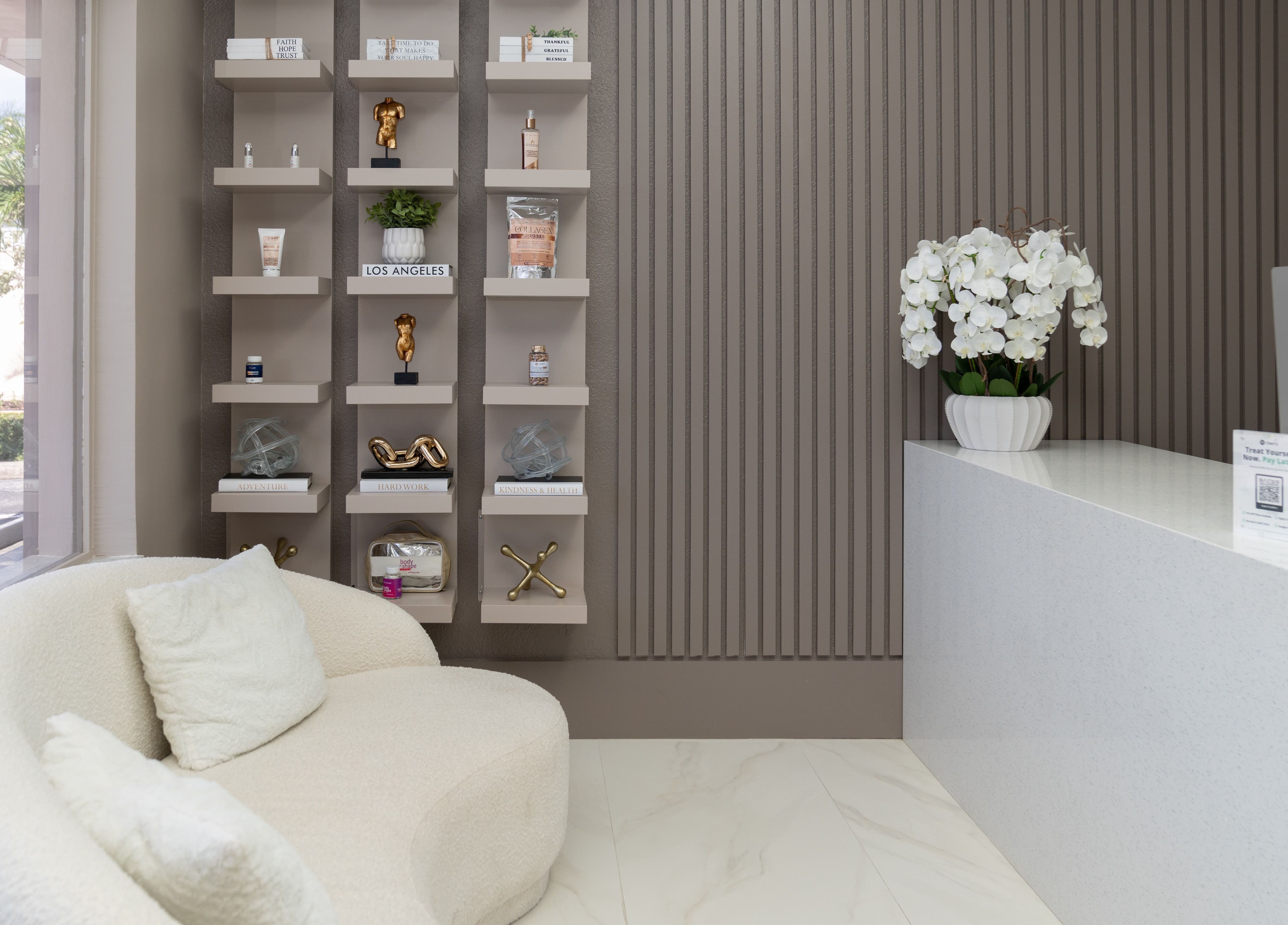 Sleek reception area at Advanced Med SPA - Deerfield Beach, Florida, US with plush seating and modern decor.