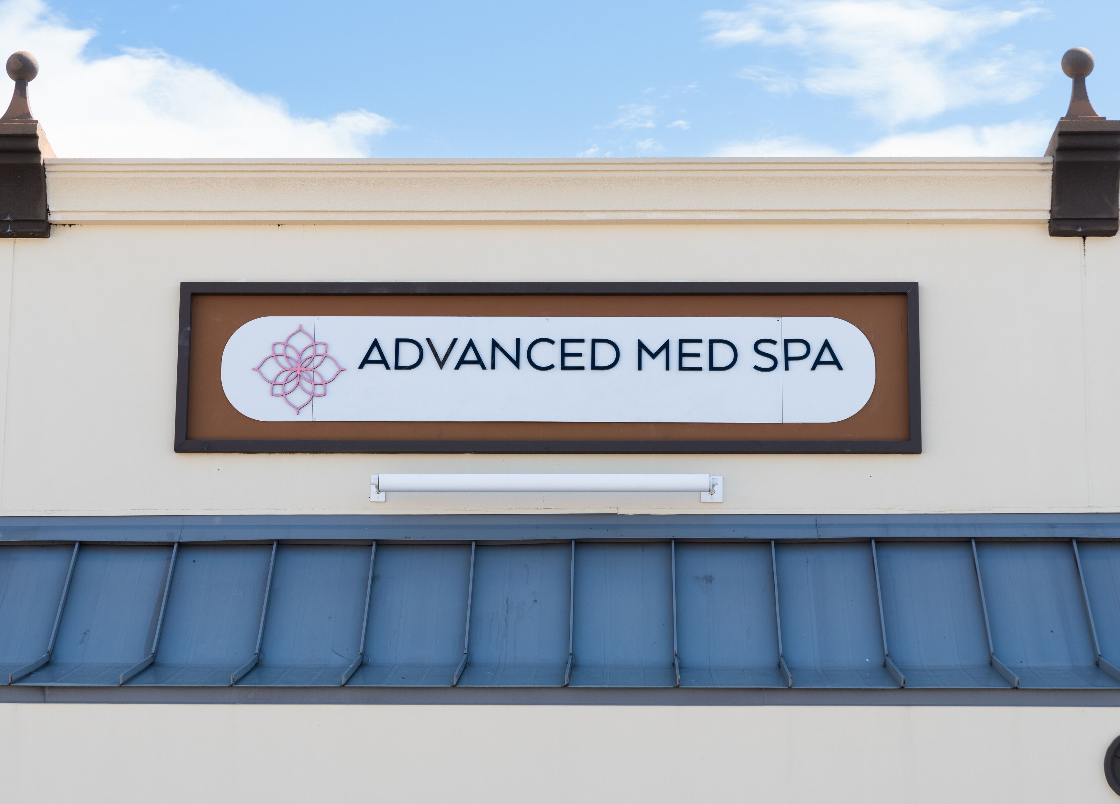 Signage of Advanced Med SPA - Deerfield Beach, located in Deerfield Beach, Florida, US, on a sunny day.