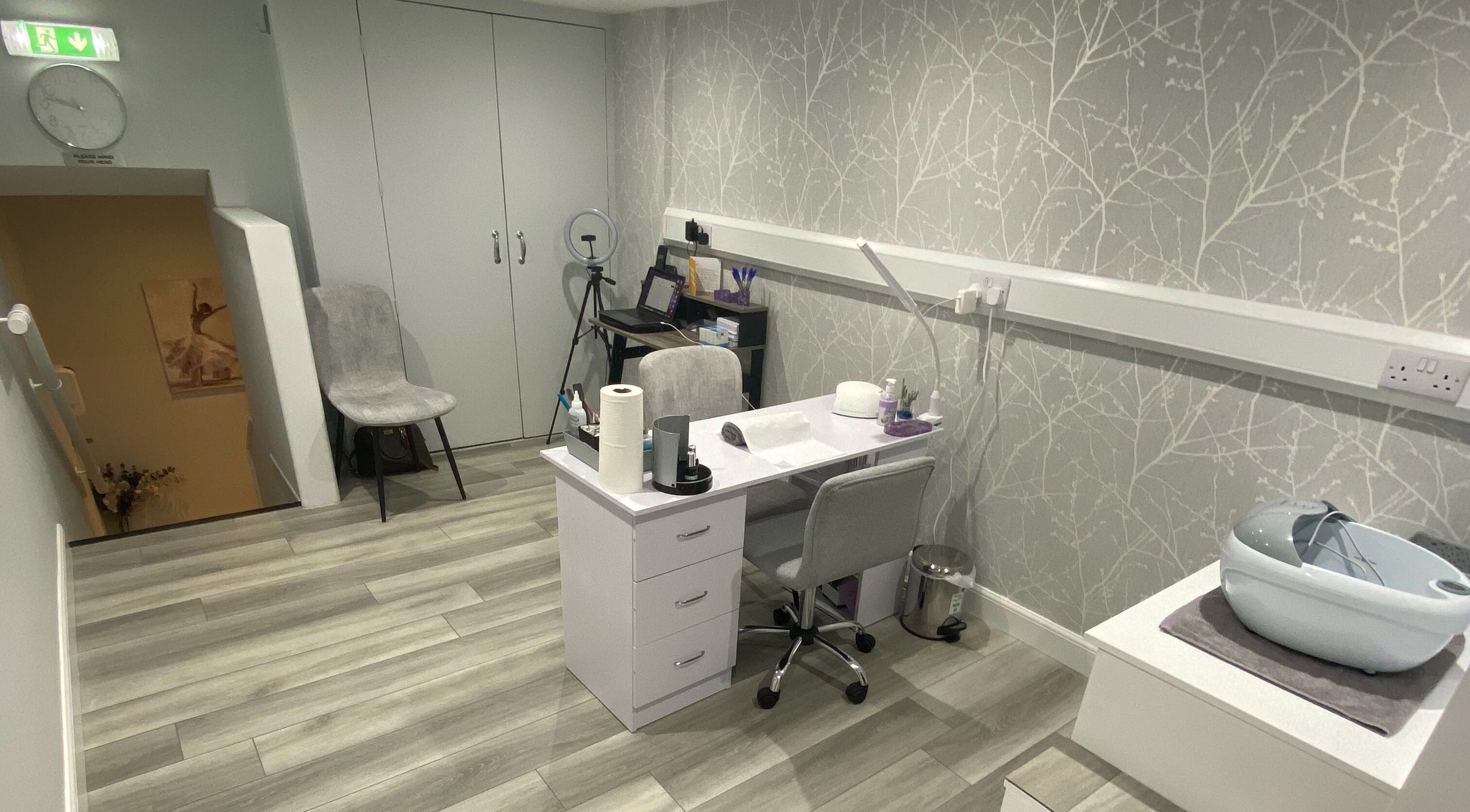 Modern therapy room at Sara Campbell Therapies, Inverness, Scotland, GB, featuring a sleek desk and stylish decor.