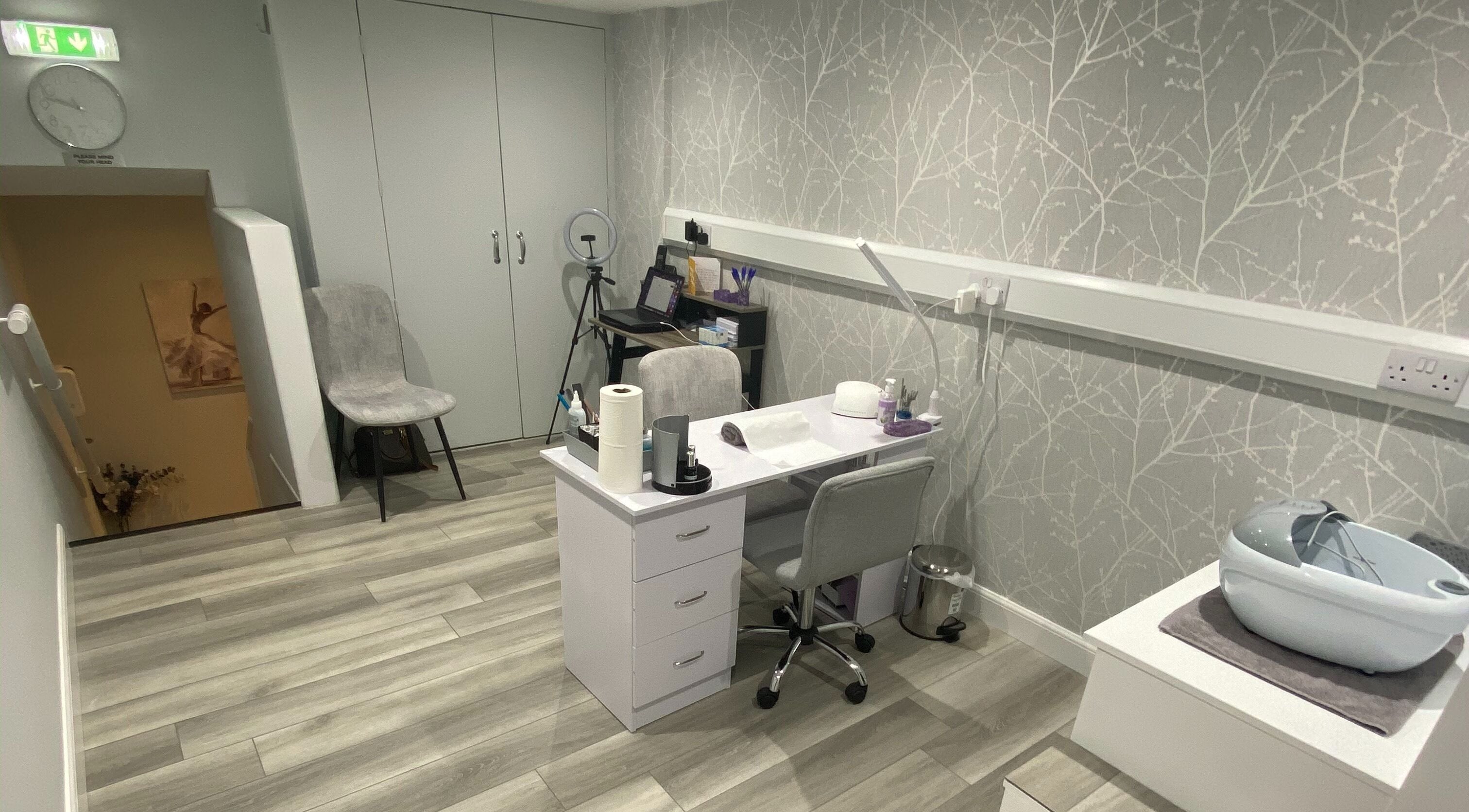Modern therapy room at Sara Campbell Therapies, Inverness, Scotland, GB, featuring a sleek desk and stylish decor.