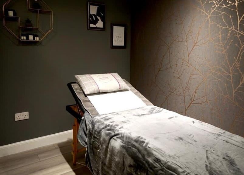 Cozy massage room at Sara Campbell Therapies in Inverness, Scotland, GB with plush table and serene decor.