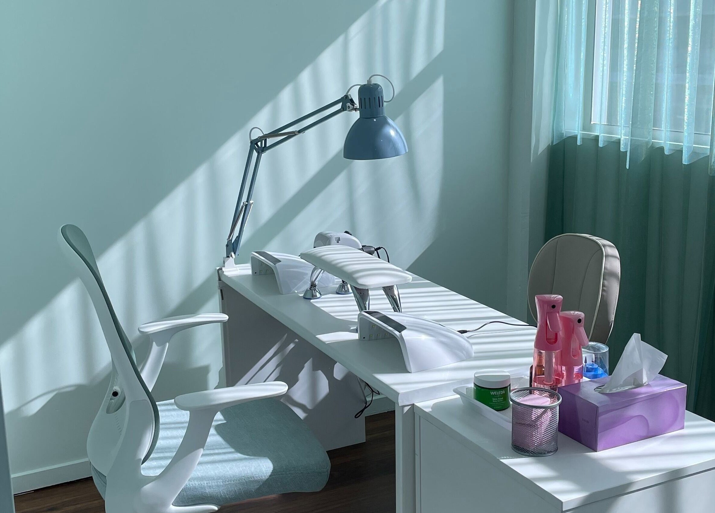 A modern nail station at Smart Nails Studio, Auckland, Auckland, NZ, with chic decor and daylight.