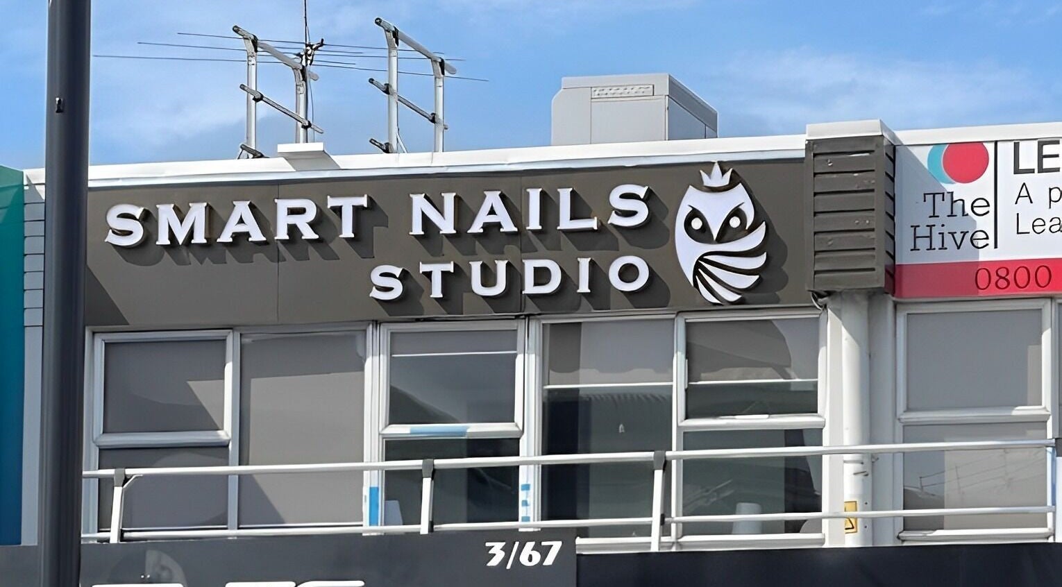 Exterior of Smart Nails Studio in Auckland, Auckland, NZ featuring bold signage and modern design.