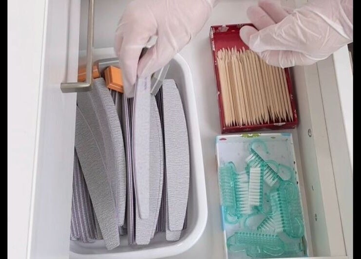 Nail care tools in a drawer at Smart Nails Studio, Auckland, Auckland, NZ, showcasing file and cuticle sticks.
