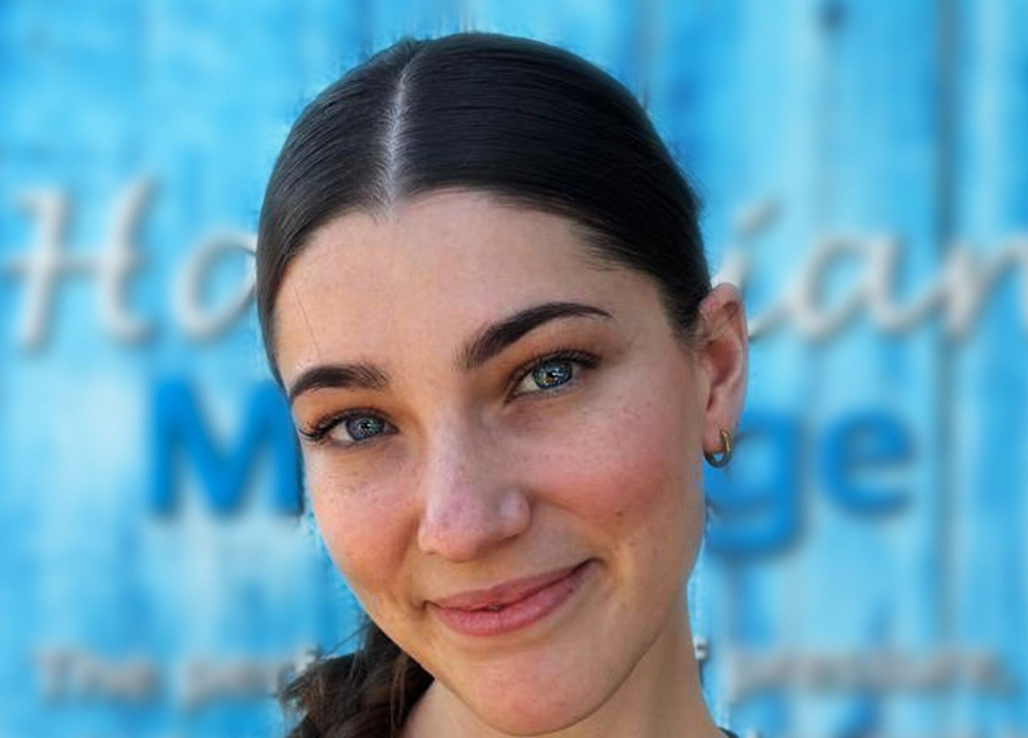 Smiling woman at Kahe Hands Wierdapark, Centurion, Gauteng, ZA, highlighting wellness services.