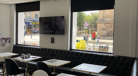 Comfortable seating area at Confidence & Glow Aesthetics in Morley, England, GB overlooking the street.