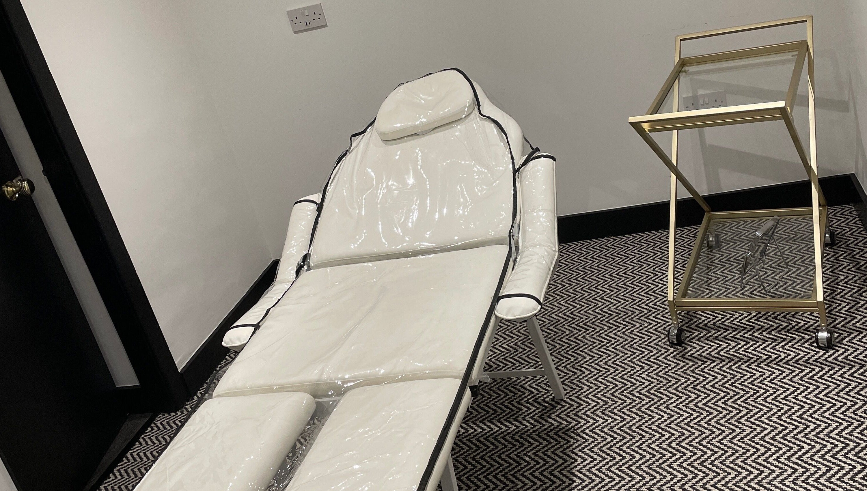 Spa treatment chair at Confidence & Glow Aesthetics in Morley, England, GB. Elegant decor and peaceful ambiance.