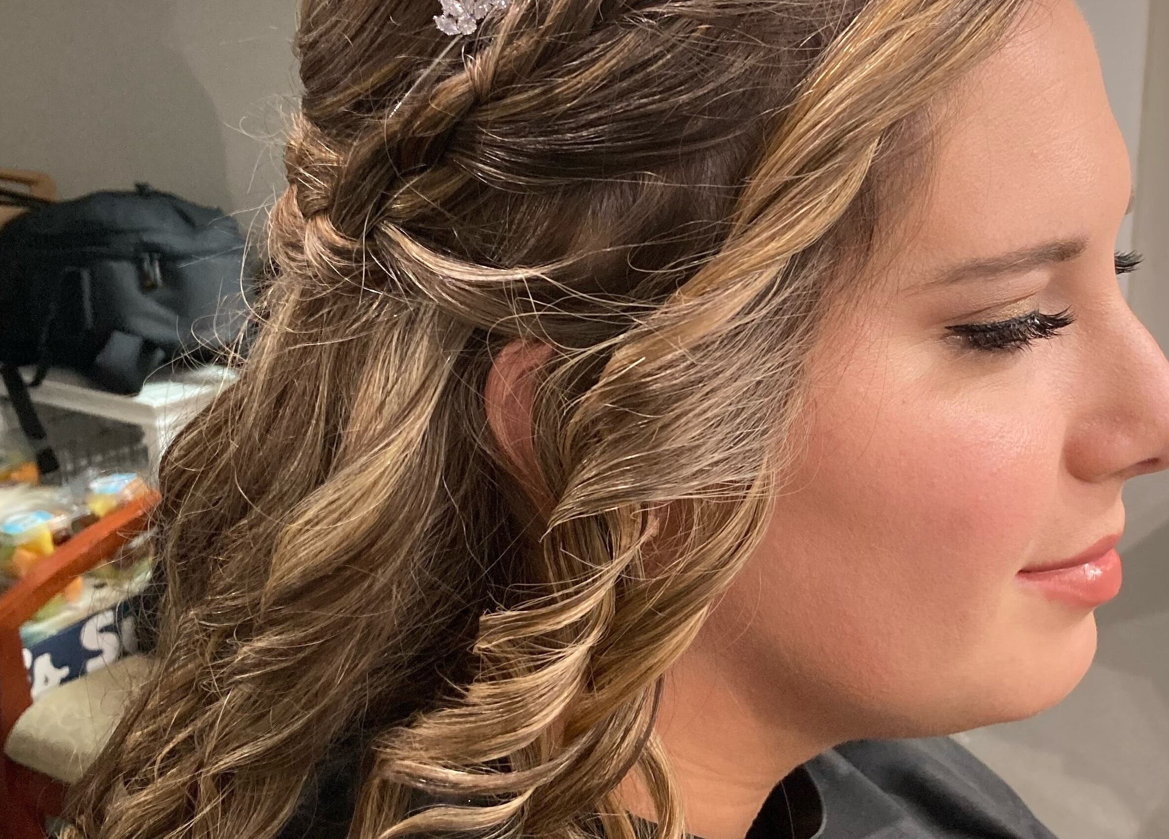 Bridal hairstyle with curls at The Cutting Post, Tannersville, Pennsylvania, US.