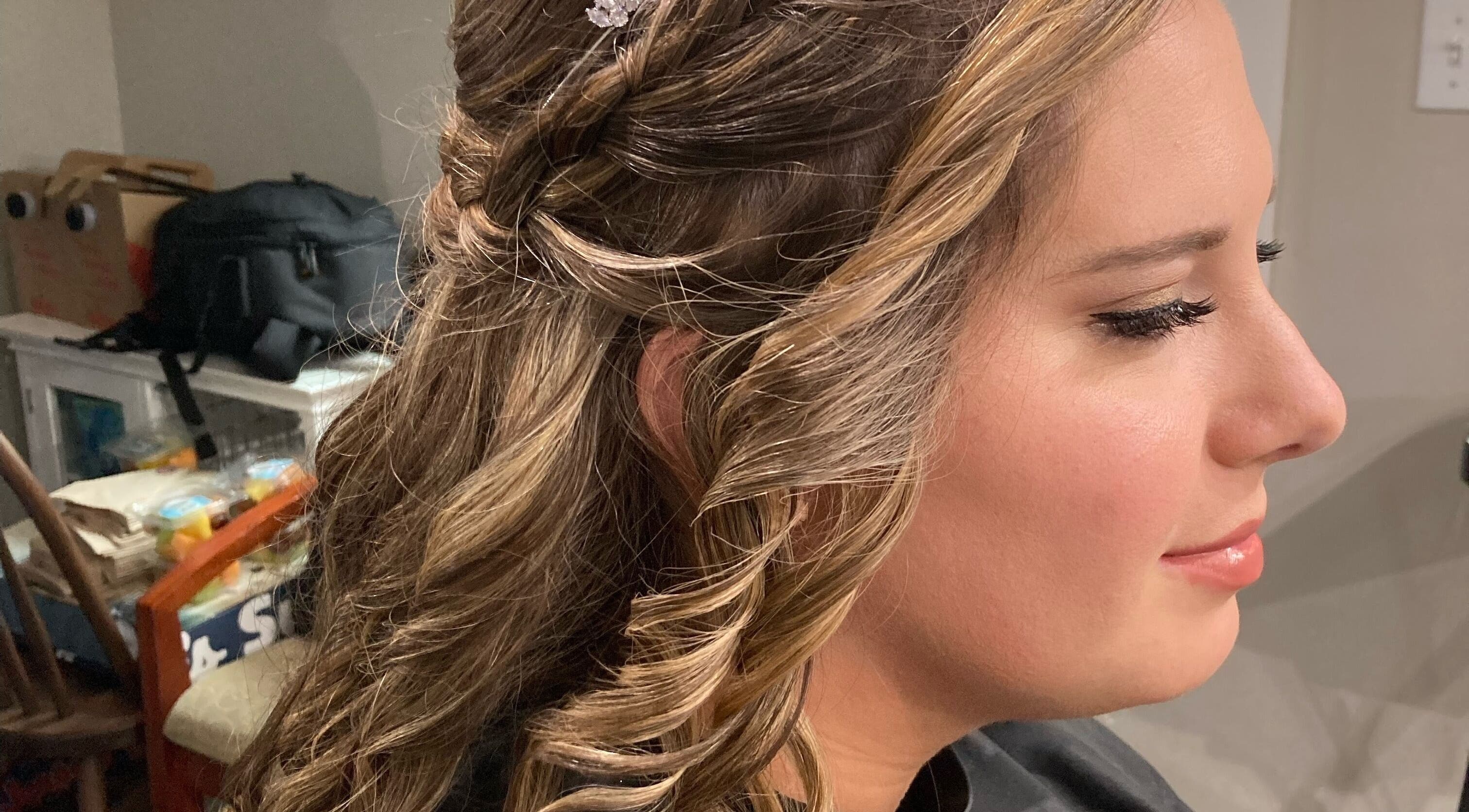 Bridal hairstyle with curls at The Cutting Post, Tannersville, Pennsylvania, US.